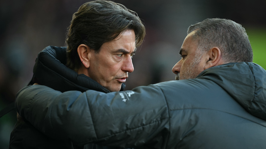 Brentford boss Thomas Frank (left) and Tottenham boss Ange Postecoglou (R) chat before kick-off in the Premier League on 2 February 2025