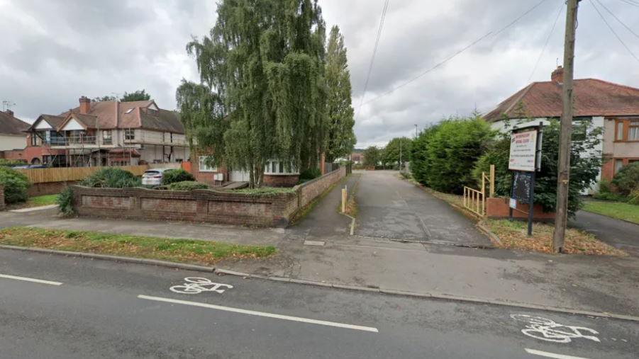 Generic view of Weddington Road, with sign advertising the social club