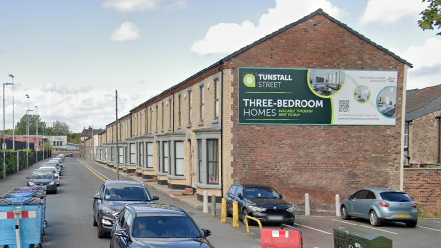 A Google Street View image shows a row of renovated terraced homes running down the right hand side of a street in Liverpool