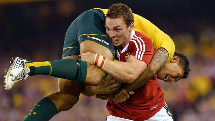 George North lifts and carries Australia's Israel Folau during the second Lions Test in 2013