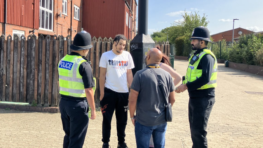 Police officers talking to members of the public