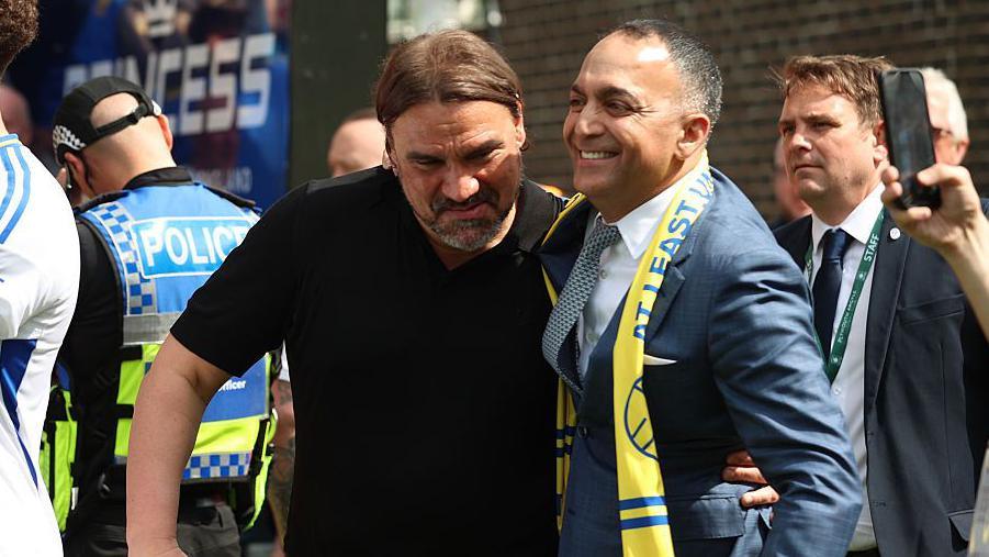Daniel Farke and Paraag Marathe embrace after Leeds were promoted to the Premier League