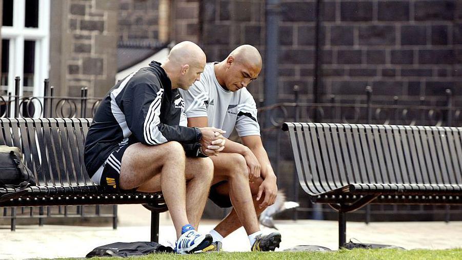 John Mitchell (right) having a quiet word with the late great New Zealand number eight Jerry Collins