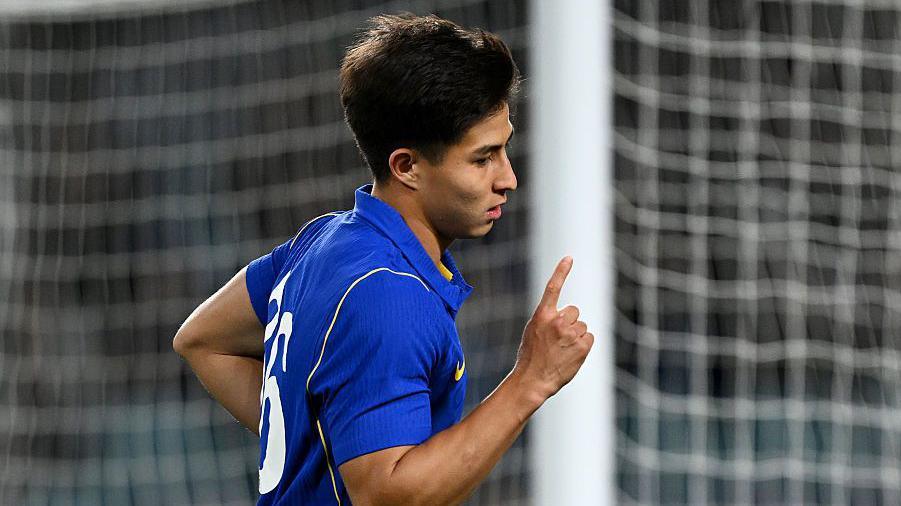 Dastan Satpaev points to the sky after scoring for Chelsea