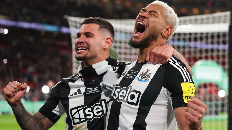 Bruno Guimaraes and Joelinton celebrate winning the Carabao Cup