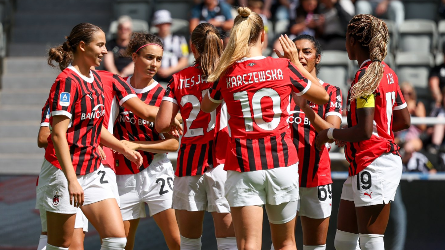 AC Milan players celebrate scoring a goal