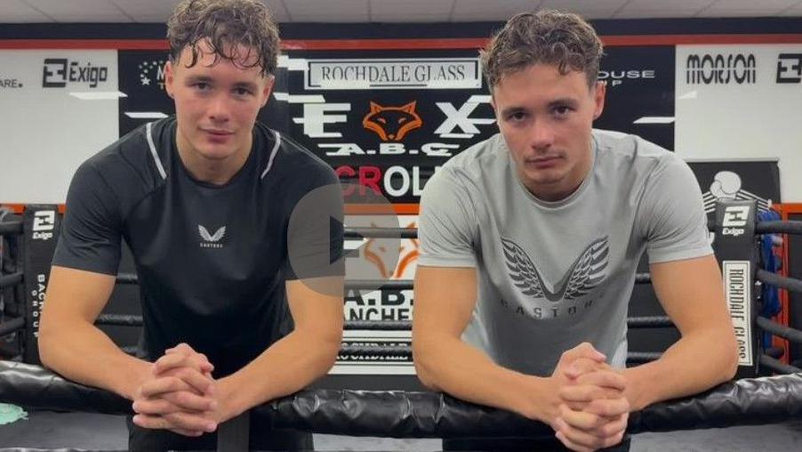 Garan (left) and Ioan Croft in t-shirts lean on the ropes at the Fox ABC gym in Oldham