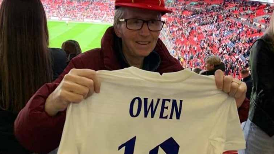 Wendy Owen with her legacy cap and England Shirt which reads Owen, 12.
