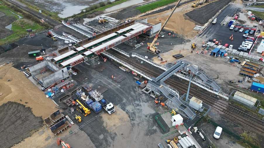 An aerial view of the construction of a road bridge over a railway line 