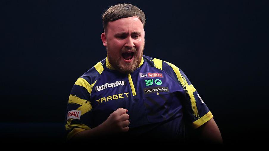 Luke Littler celebrates