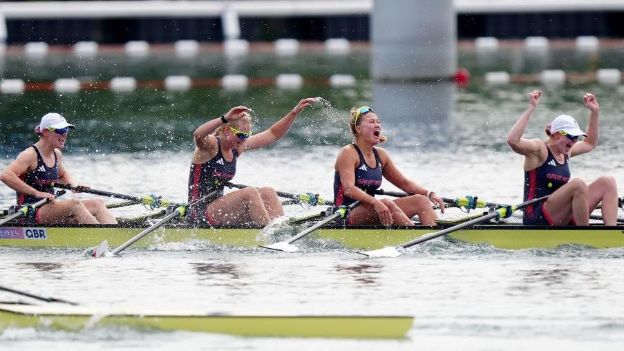 Great Britain’s Lauren Henry, Hannah Scott, Lola Anderson and Georgie Brayshaw celebrate winning a gold medal following the Women's Quadruple Sculls Fin