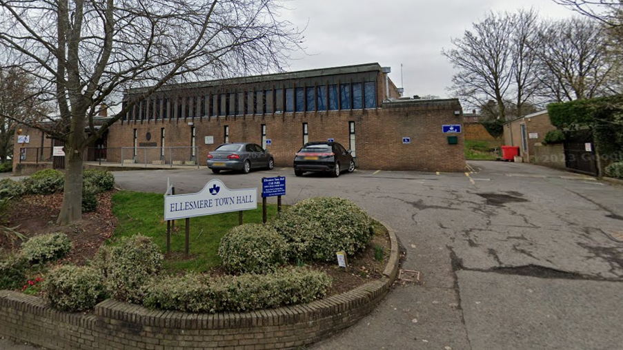 The front of Ellesmere Town hall and its entrance sign