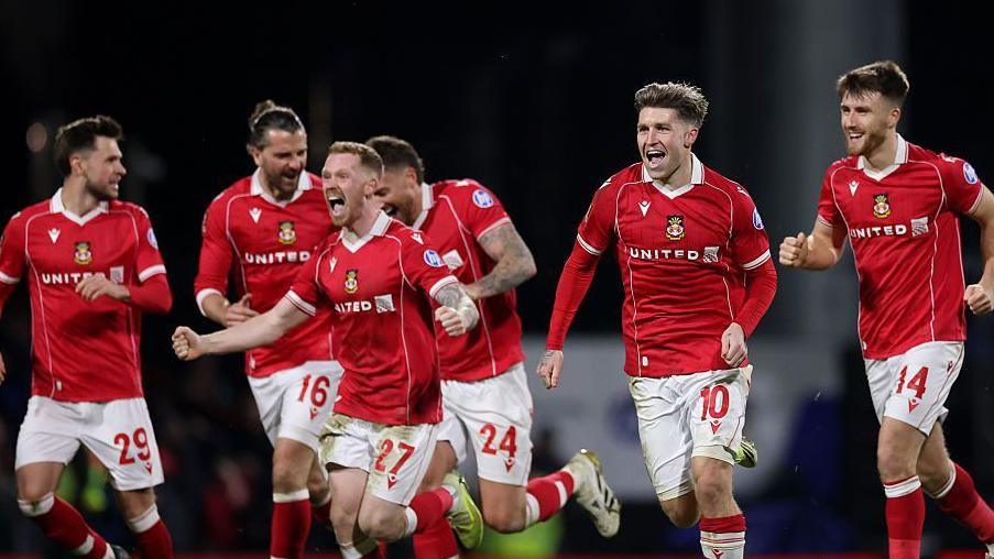 Wrexham players celebrate beating Nottingham Forest