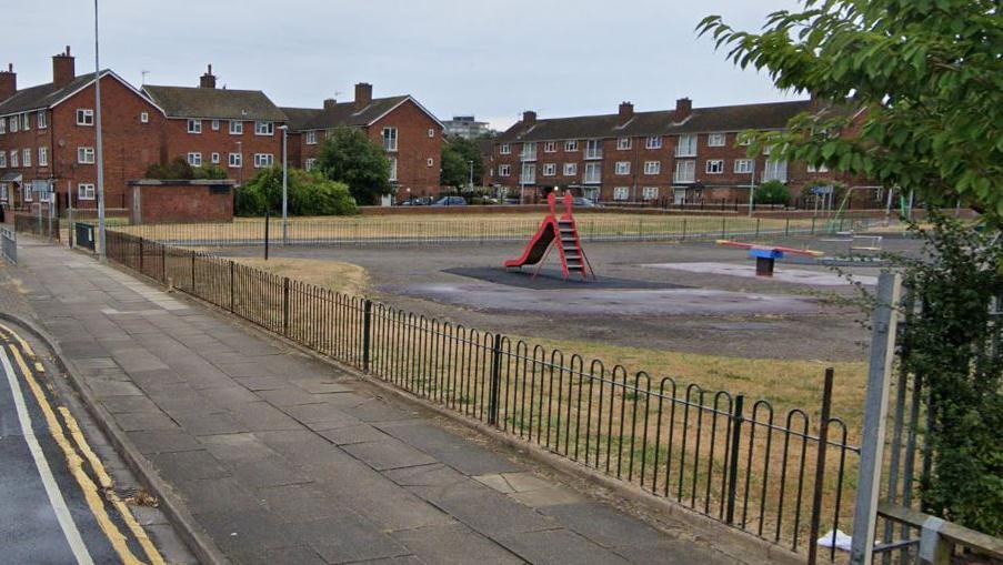 Google image shot of a play park on the East Marsh estate with houses in the distance.