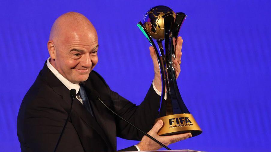 Fifa president Gianni Infantino with the club World Cup trophy