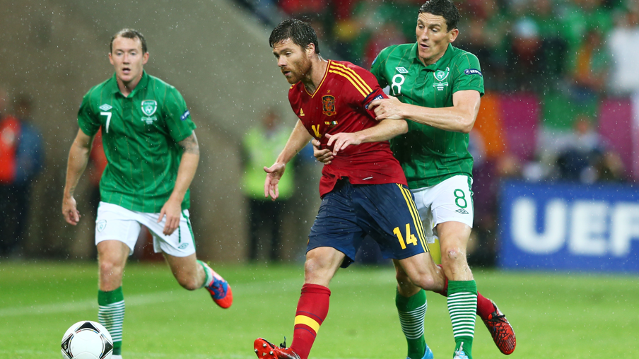 Keith Andrews of Republic of Ireland and Xabi Alonso of Spain compete for the ball during the Euro 2012 Group C match between Spain and the Republic of Ireland
