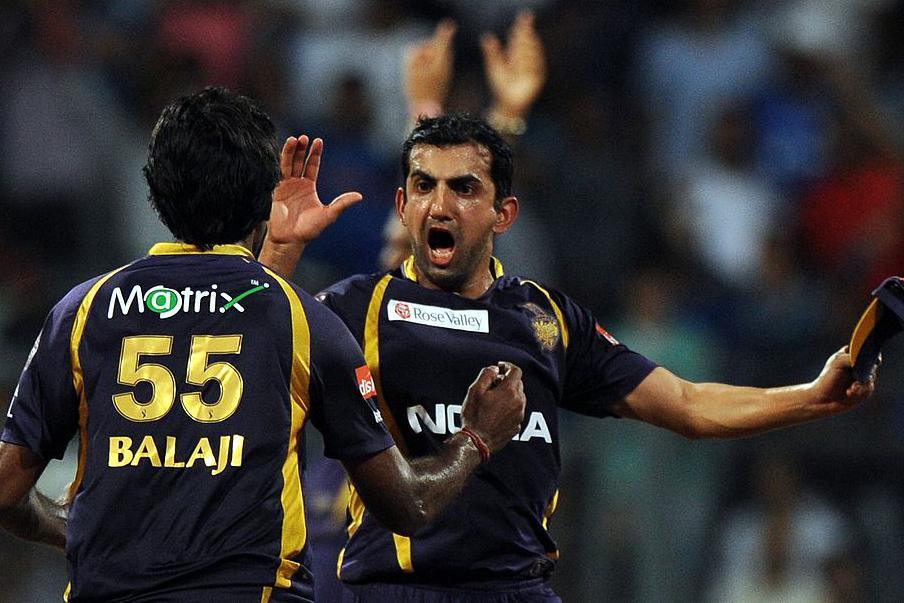 Kolkata Knight Riders cricketer Gautam Gambhir celebrates with teammate Laxmipathy Balaji after winning the IPL Twenty20 cricket match between Mumbai Indians and Kolkata Knight Riders at The Wankhede Stadium in Mumbai on May 16,