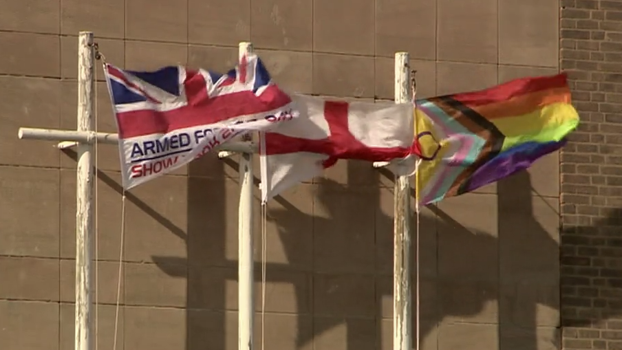 Flags flying outside Shire Hall, with the Progress Pride Flag at the centre of the political row pictured on the right-hand side.