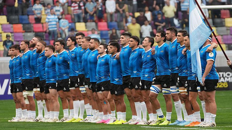 Argentina lining up in their replica 1986 World Cup shirts