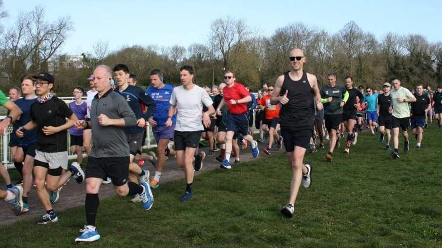 Men running on York Racecourse