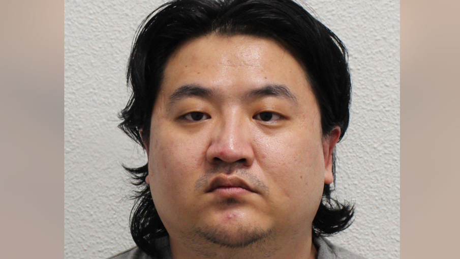 Man looks at camera in mug-shot