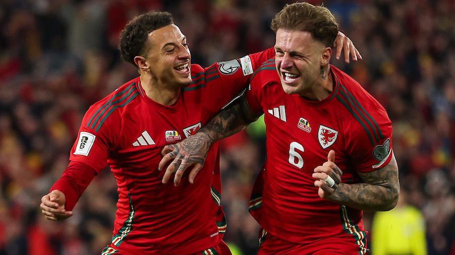 Ethan Ampadu and Joe Rodon celebrate as Rodon scores against Belgium