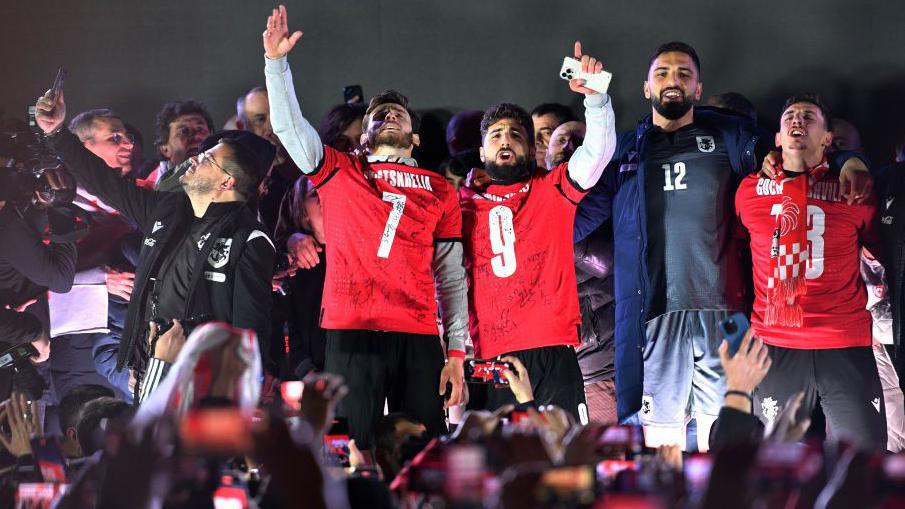 Georgia players and fans celebrate