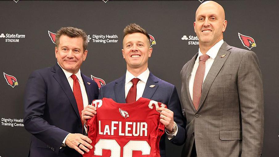 Arizona Cardinals owner Michael Bidwill with new head coach Mike LaFleur and general manager Monti Ossenfort at a news conference in February 2026 