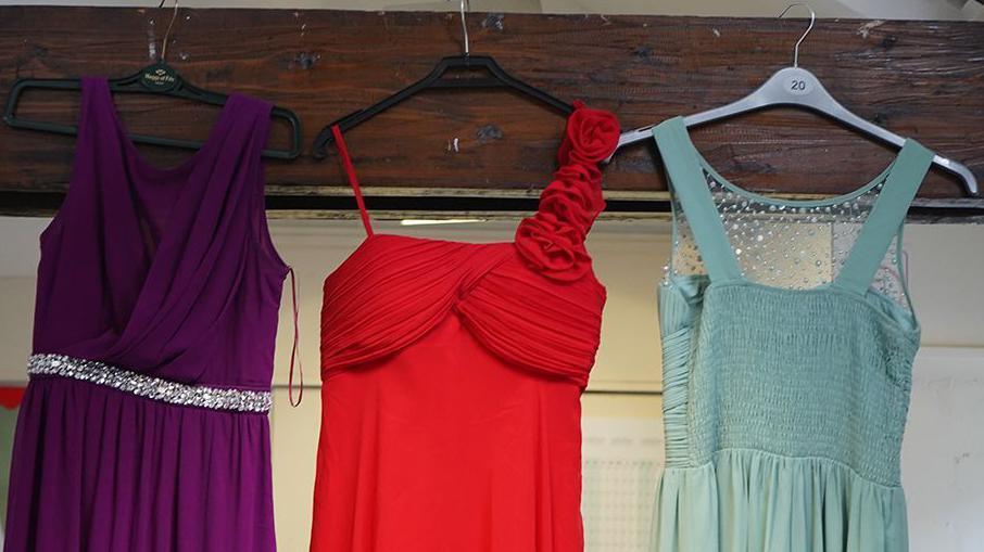 three of the dresses available to pupils struggling to go to the prom