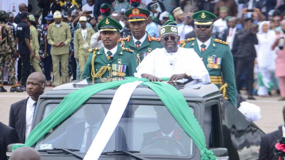 Nigeria's President Bola Tinubu (C) makes gesture during his inauguration at a swearing-in ceremony at the Eagle Square in Abuja, Nigeria on May 29, 2023