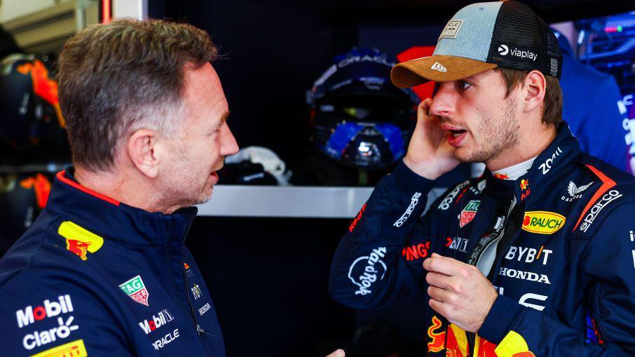 Red Bull team boss Christian Horner speaking to Max Verstappen