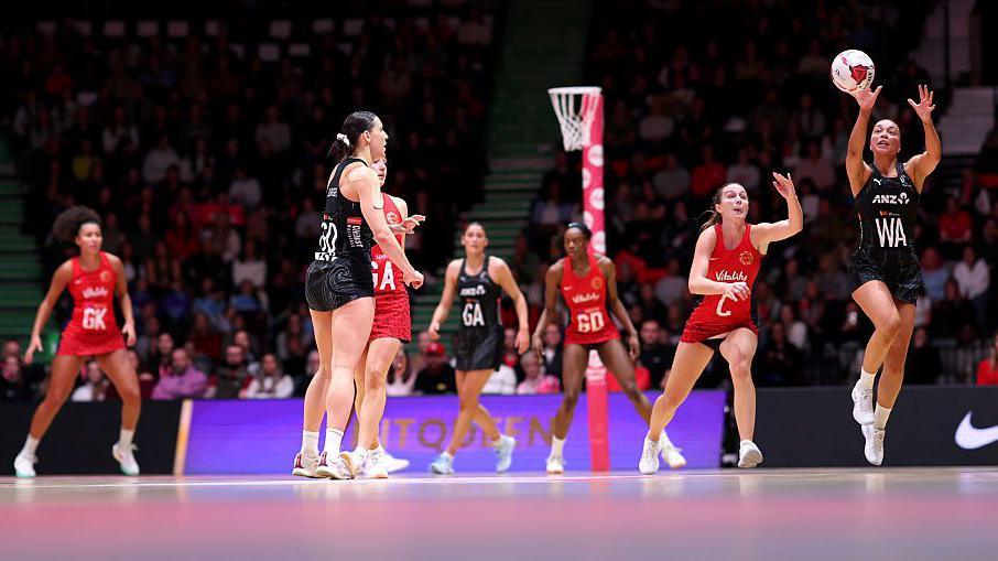 New Zealand wing attack intercepts ball.