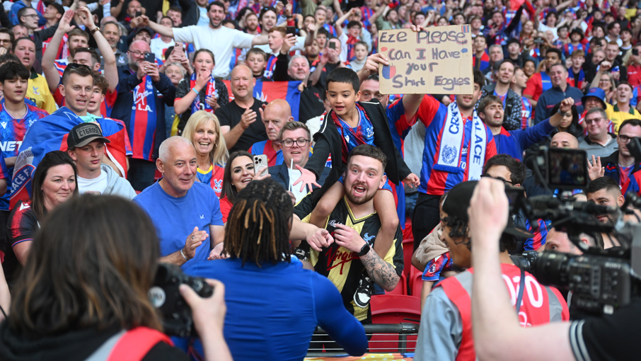 Eberechi Eze hands his shirt over to a young fan after Crystal Palace beat Aston Villa 3-0 in the FA Cup semi-final at Wembley