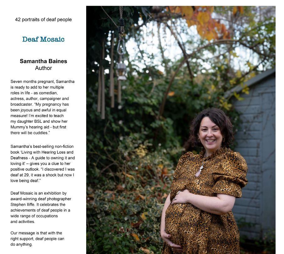 Samantha Baines in the exhibition. In the description on the left hand side, she talks about her current pregnancy and her experience when she went deaf at 29. In the photo, she is wearing a leopard print dress and has her left arm over her baby bump. 