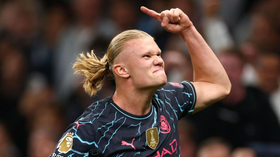 Man City's Erling Haaland celebrates scoring against Spurs