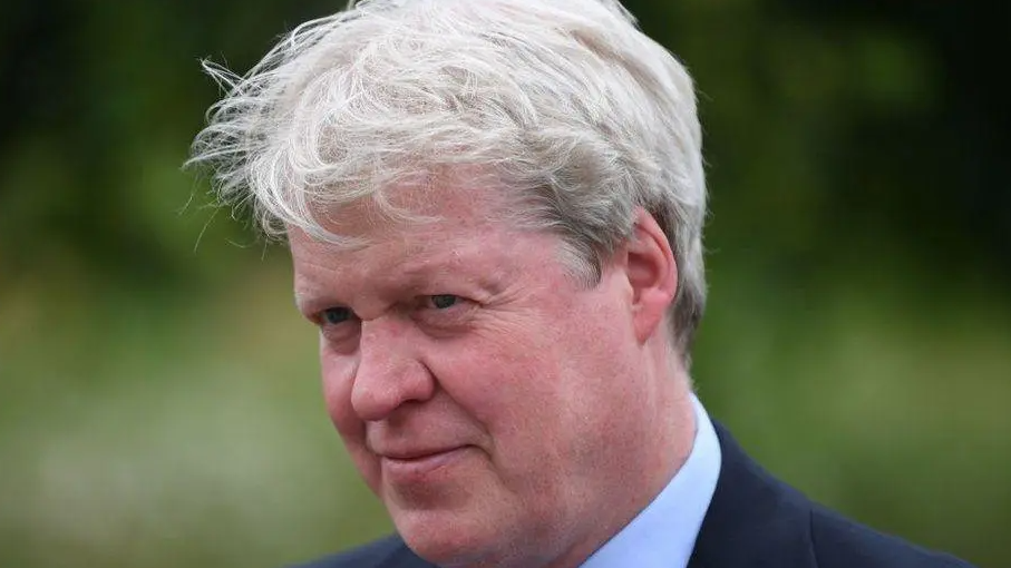 Earl Charles Spencer in a navy suit and white shirt