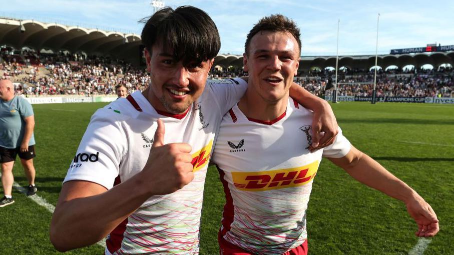 Harlequins fly-halves Marcus Smith and Jarrod Evans who celebrate a victory for the English club