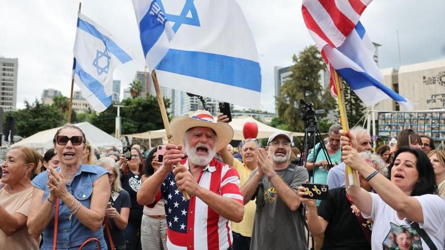 People gather at the "Hostages square" after U.S. President Donald Trump announced that Israel and Hamas agreed on the first phase of a Gaza ceasefire, in Tel Aviv, Israel, October 9, 2025.