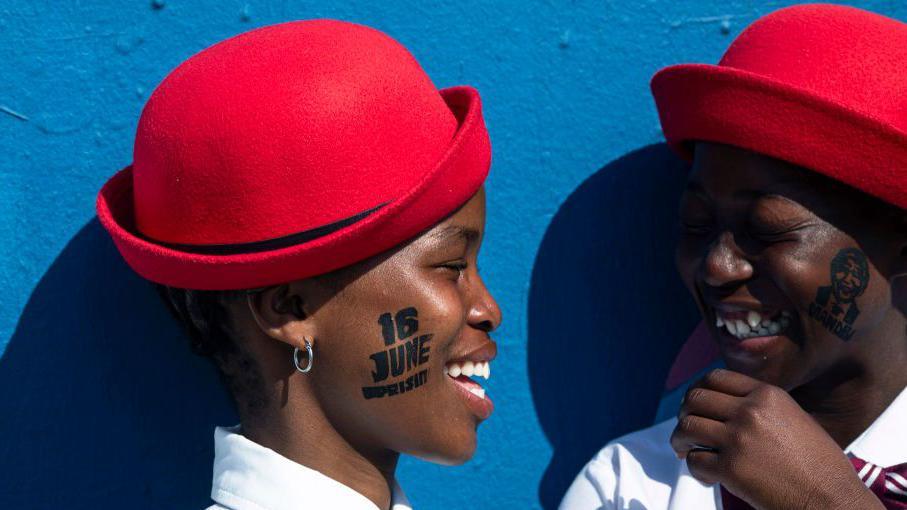 Girls in a dance group waits to perform on Vilakazi street on June 16, 2024 in Soweto, South Africa. The Soweto Uprising began on June 16, 1976, as a peaceful student protest against the enforcement of Afrikaans in schools. The police and army's response with tear gas and bullets led to violent clashes, resulting in the deaths of 400 to 700 people, many of them children. The event galvanized international opposition to apartheid and is commemorated annually in South Africa as Youth Day. 