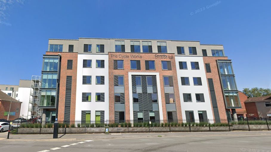 An exterior image of The Cycle Works student accommodation in Coventry, taken from across a road on a sunny day