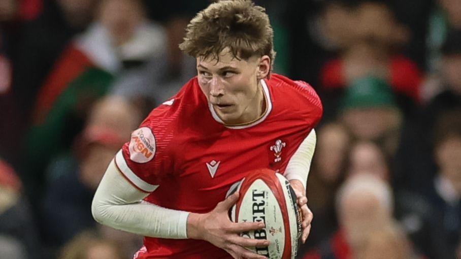 Ellis Mee looks to attack with the ball for Wales against Ireland