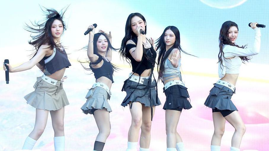 (L - R) Hyein, Hanni, Minji, Haerin and Danielle of NewJeans perform in concert during Lollapalooza in Chicago, 2023