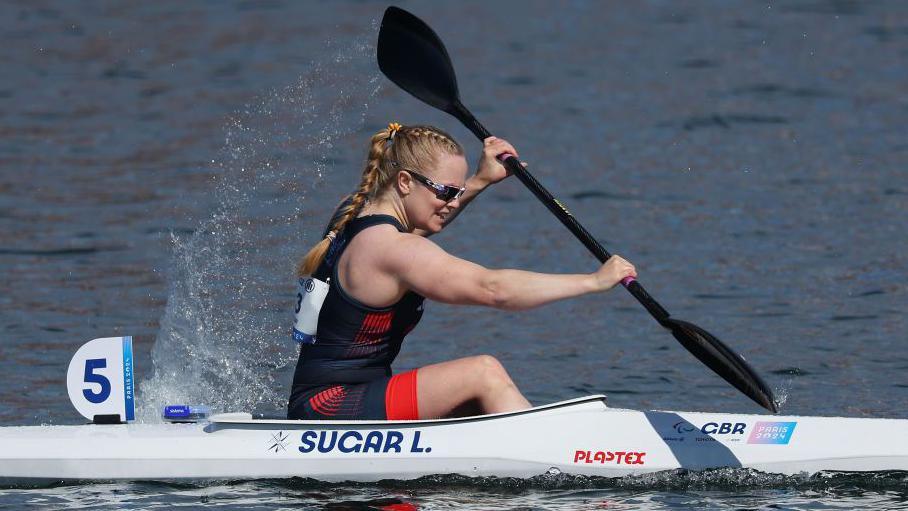 British Para-canoeist Laura Sugar paddles during a race at the 2024 Paris Paralympics