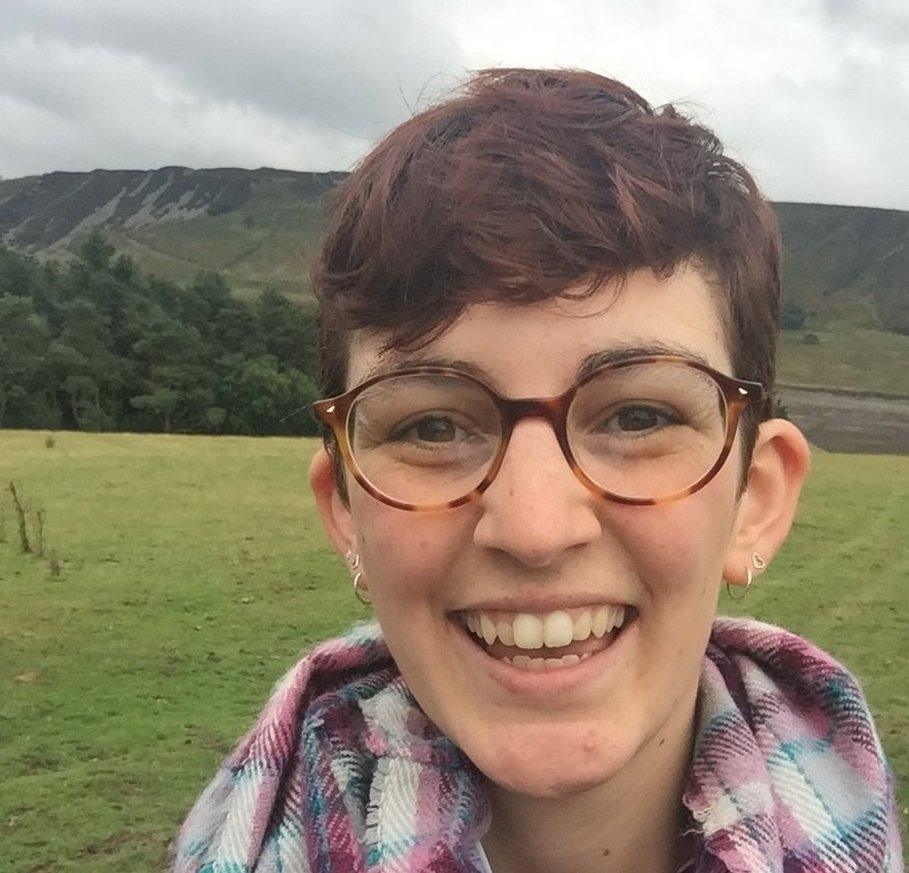 Rose-Anne smiling in the countryside