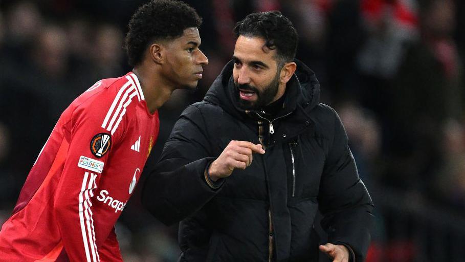 Marcus Rashford speaking to Ruben Amorim before coming on as a substitute.