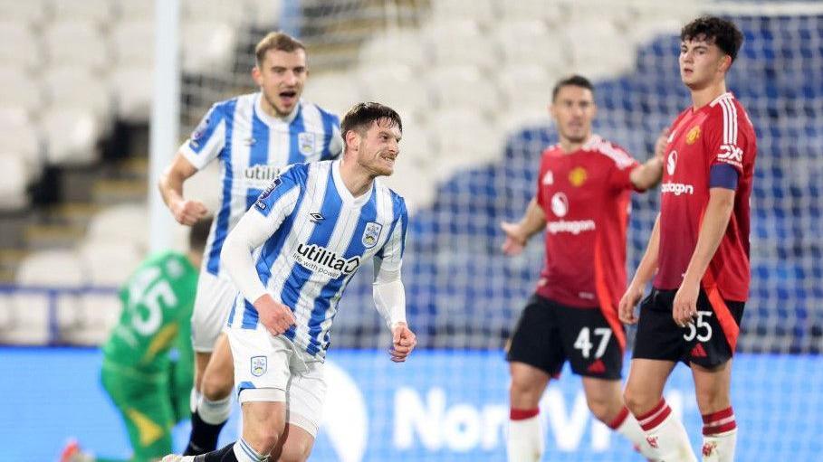 Huddersfield's Ben Wiles celebrates scoring the opening goal in his side's 4-1 win against Manchester United Under-21s