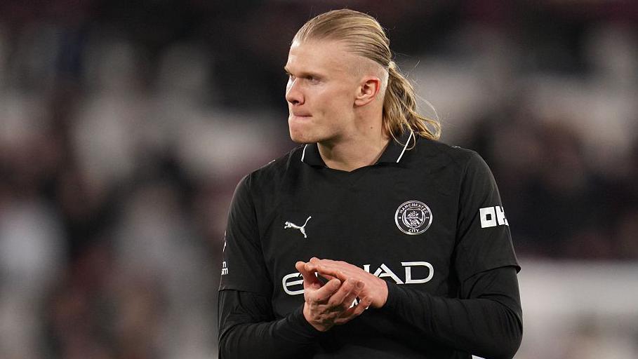 Erling Haaland claps the fans after a game
