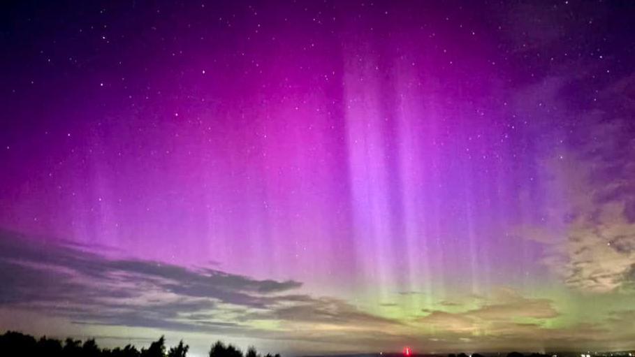 A deep purple and green sky over Ruardean Hill in the Forest of Dean