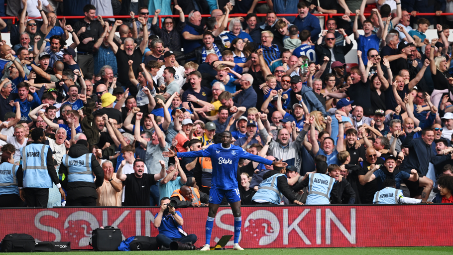 Everton fans celebrate behind Abdoulaye Doucoure following his goal against Nottingham Forest