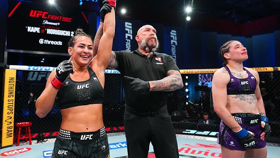 Bia Mesquita of Brazil reacts after a submission victory against Melissa Mullins of England